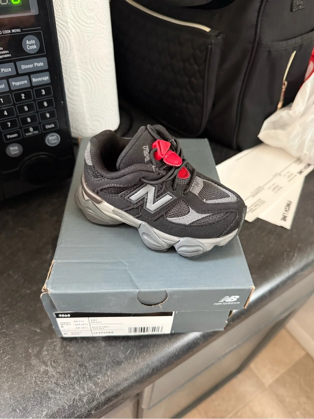 New Balance Kids 9060 Black and Gray Sneaker with Red Accent size 6c